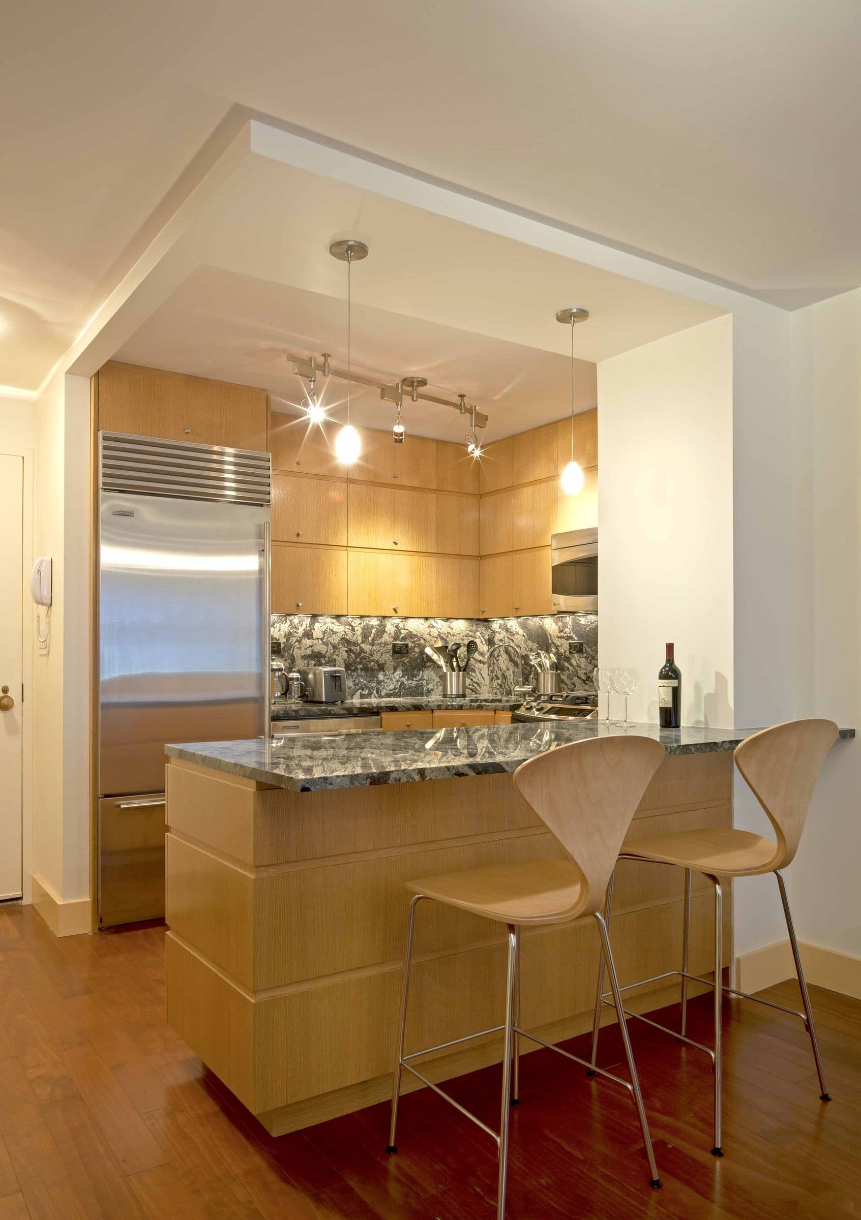 Baxter Residence, A prewar co-op reopened to its own light without moving a single wall the board wouldn't allow.
