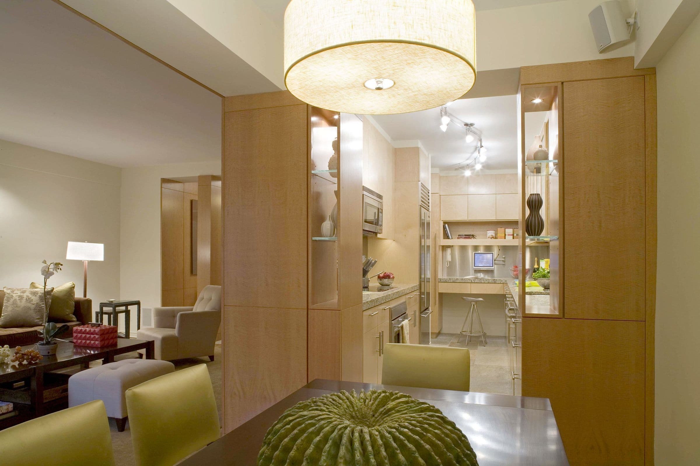 The Shaw Residence dining area looking through a widened opening into the kitchen