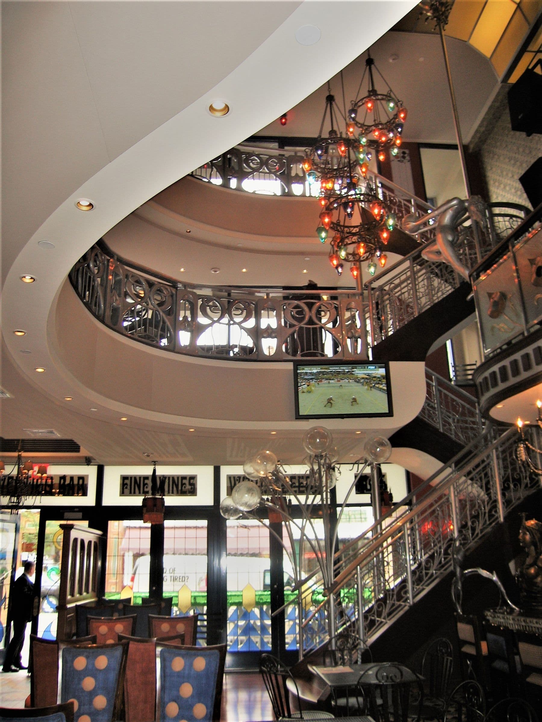 The central atrium at Vertigo, balconies and a chandelier connecting all three floors