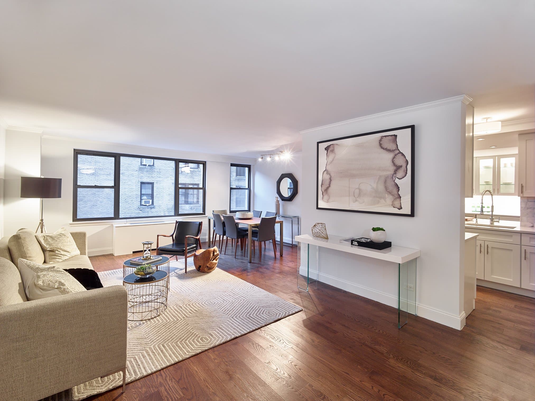 Greenbaum Residence, Two apartments made into one, organized around a single line of light.