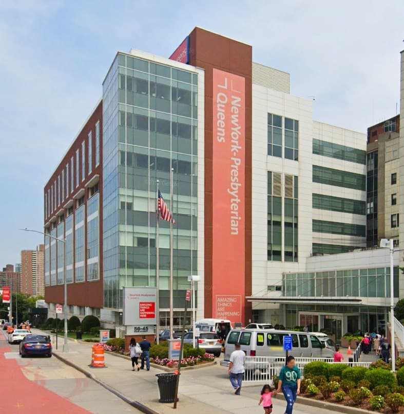 The new entrance of NewYork-Presbyterian Queens, glass curtain wall with hospital signage